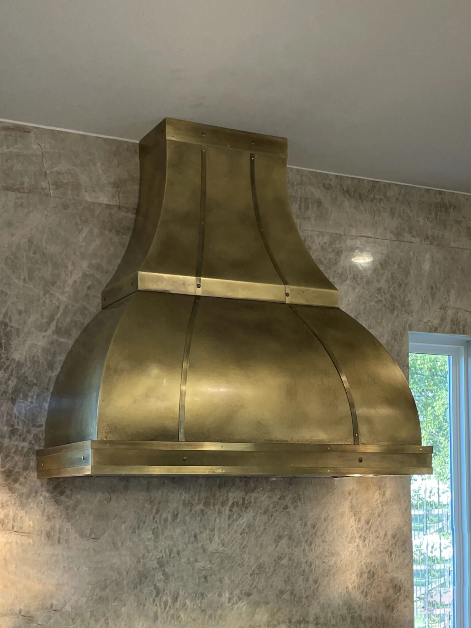 Monarch antiqued cloudy brass custom range hood, installed view 1