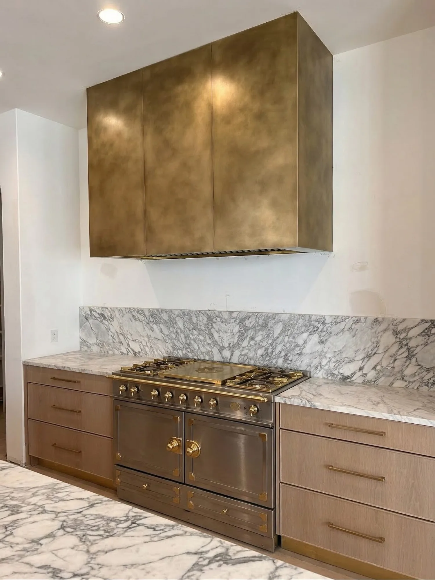 Monarch antiqued cloudy brass custom range hood, installed view 2