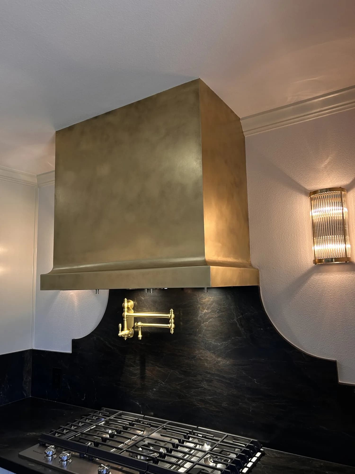 Monarch antiqued cloudy brass custom range hood, installed view 4