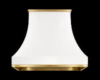 The Belle Terre range hood in white powder coated steel with brushed brass trim.