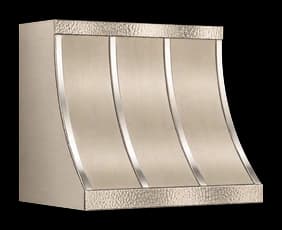 The Montauk Refined range hood in brushed steel with a honeycomb patina.