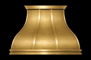 The Northport Luxe range hood in matte brass with brushed brass trim.