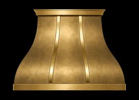The Northport Refined range hood in matte brass with brushed brass trim.